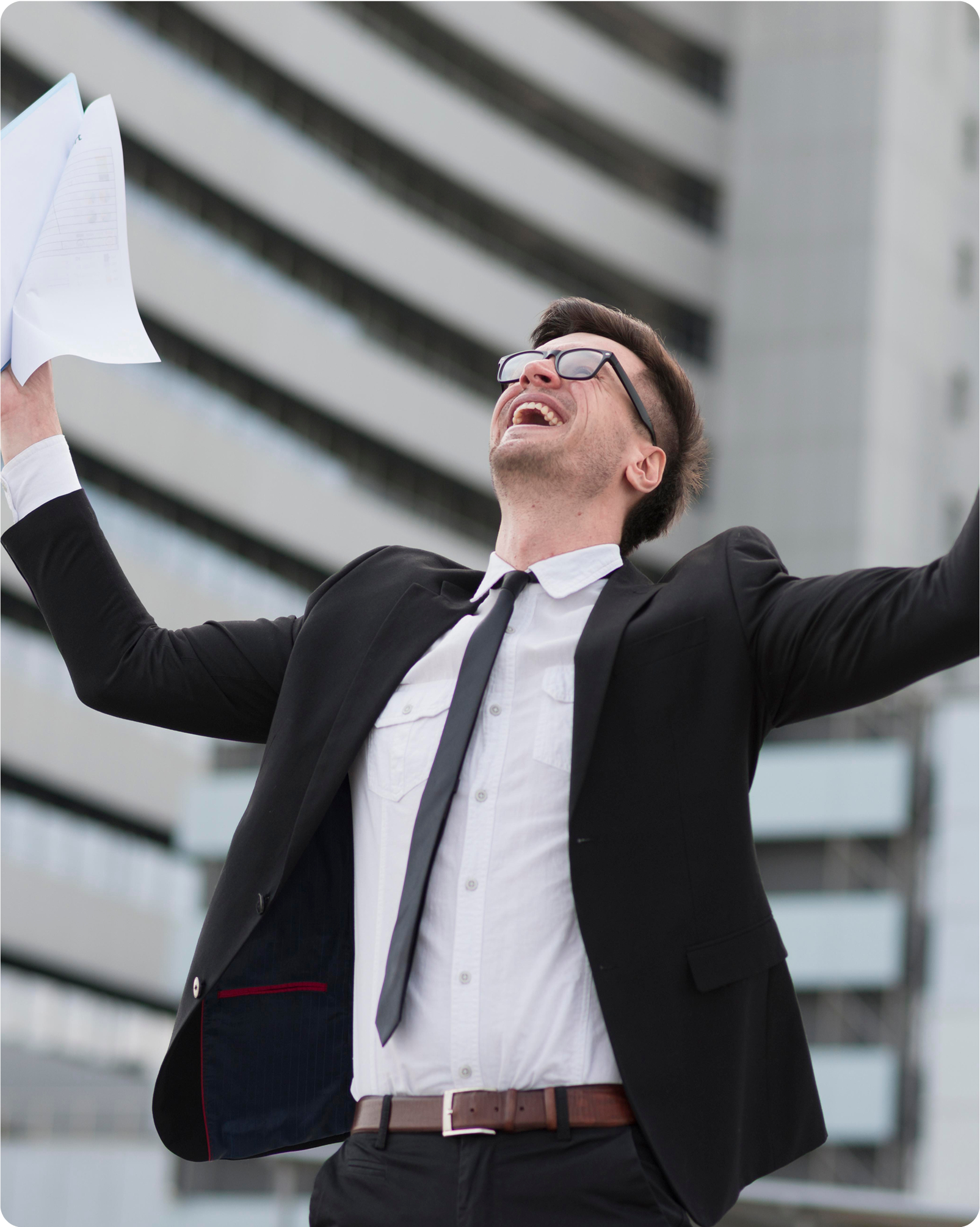 Excited professional holding papers